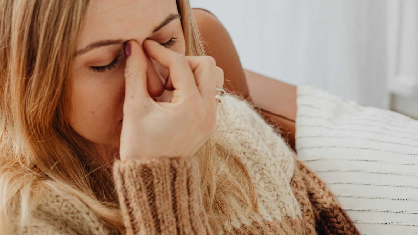 Student resting in bed and looking unwell